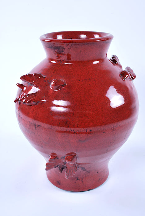 Vaso in ceramica rosso con decorazioni